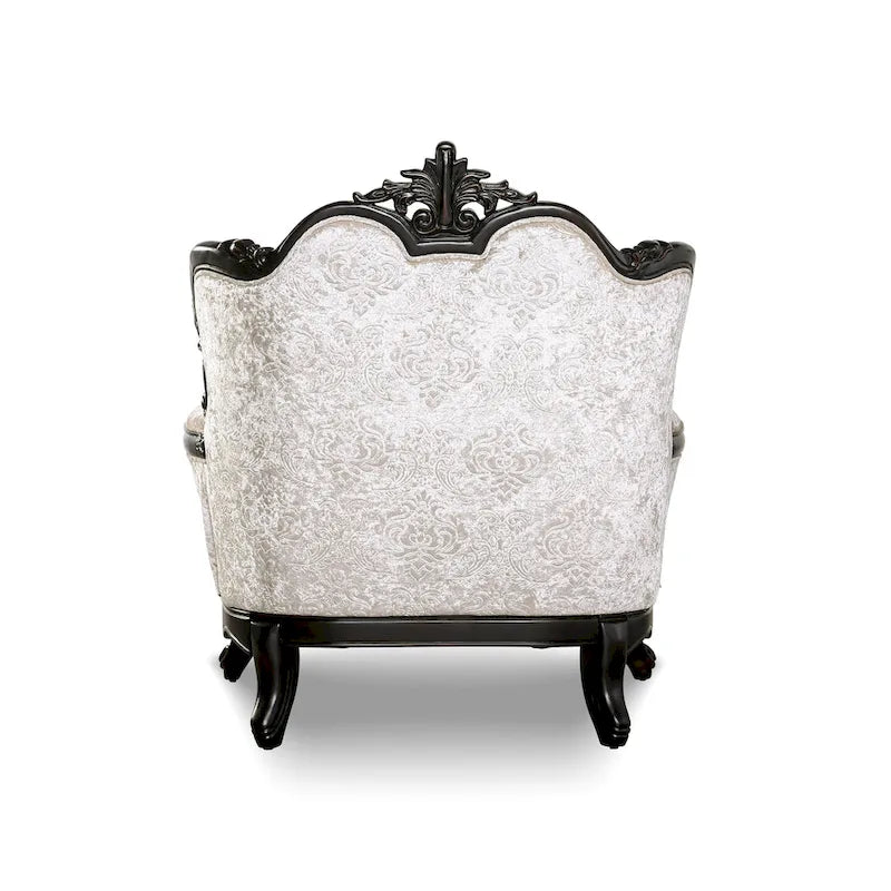 Fauteuil traditionnel avec dossier capitonné et coussin décoratif